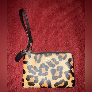 Cheetah print Coach wristlet.